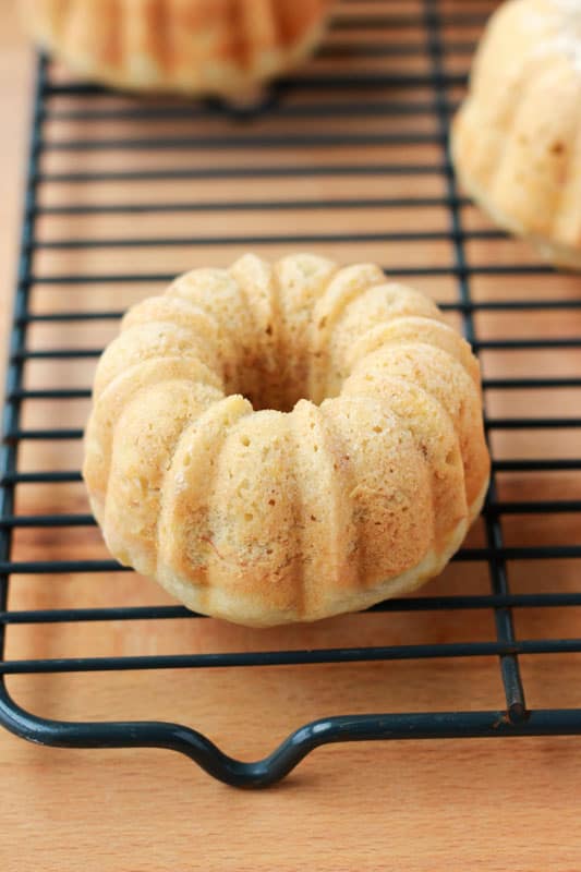 mini coconut bread on a wire rack cooling