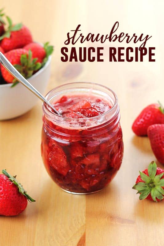 strawberry sauce in a mason jar with a spoon