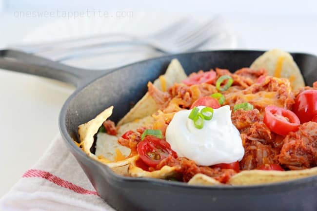 pulled pork nachos in a skillet