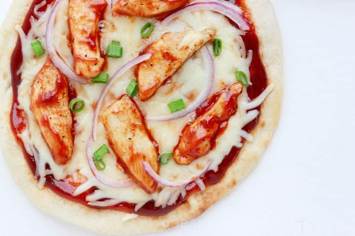 close up image of a chicken pizza with bbq sauce