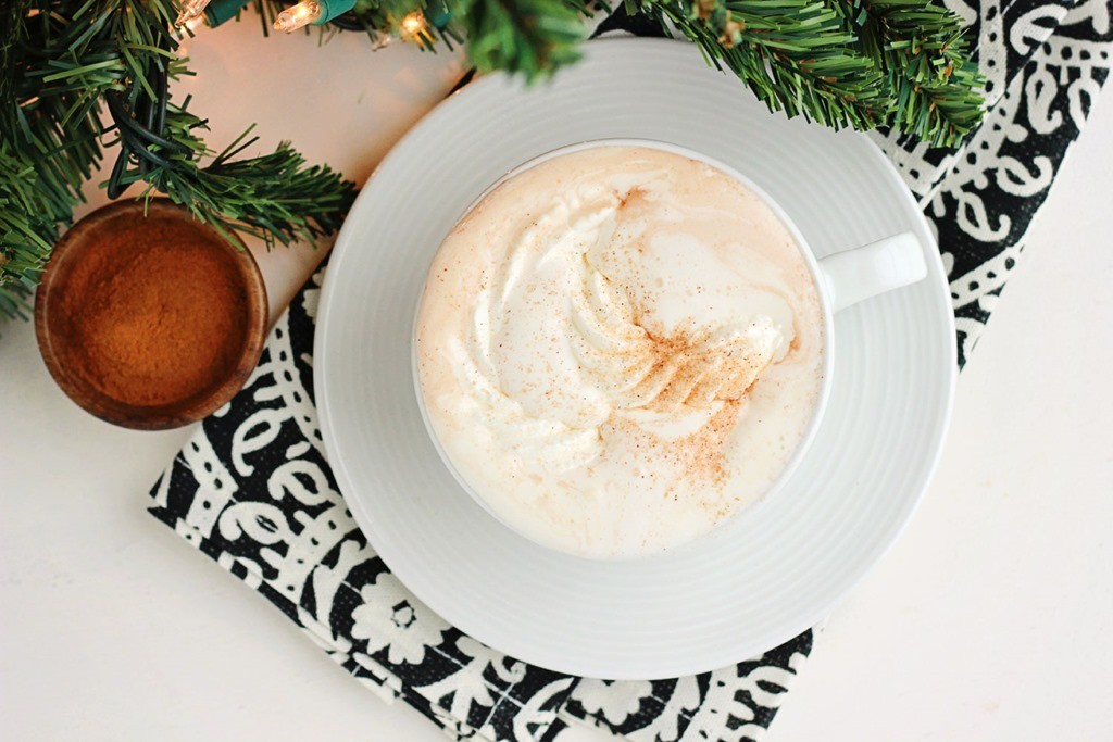 top down image of a cup of hot chocolate topped with whipped cream