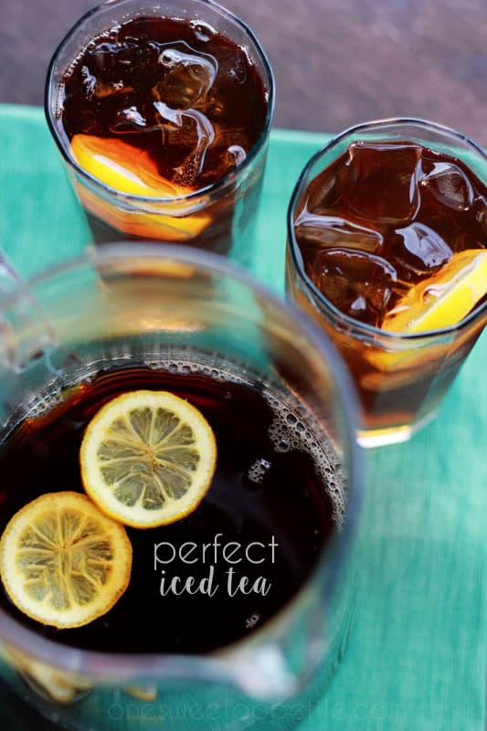 top down image of a pitcher and two glasses filled with tea and lemon slices