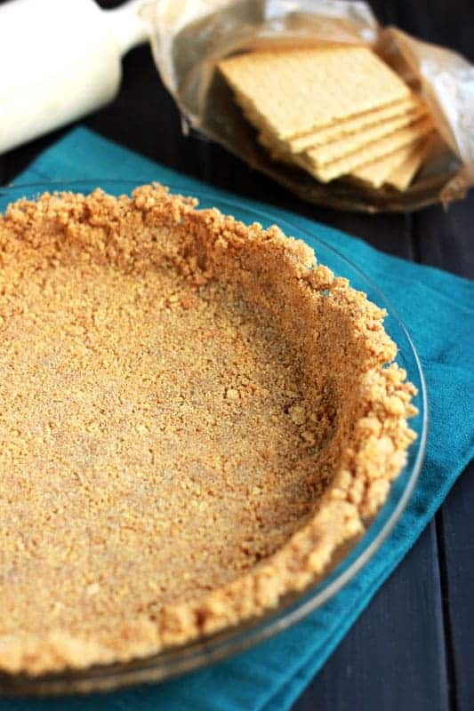 close up image of a graham cracker crust packed and waiting to be filled