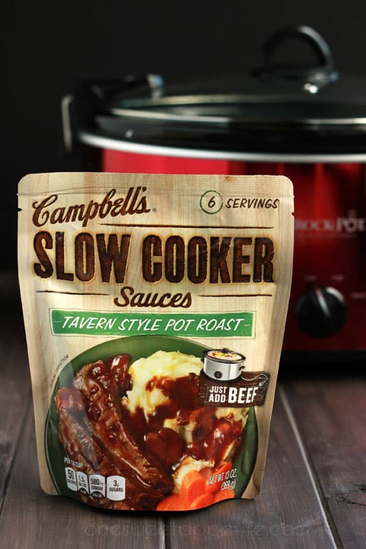 package of Campbell's slow cooker sauces tavern style pot roast sitting in front of a slow cooker