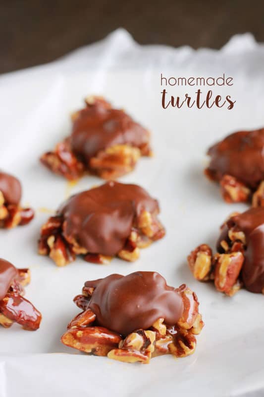 homemade turtle candy sitting on a white piece of parchment