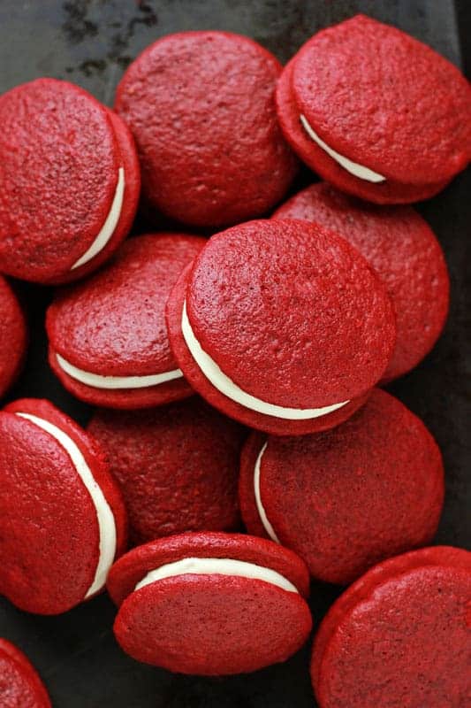Stack of Red Velvet Whoopie Pies on a black tray