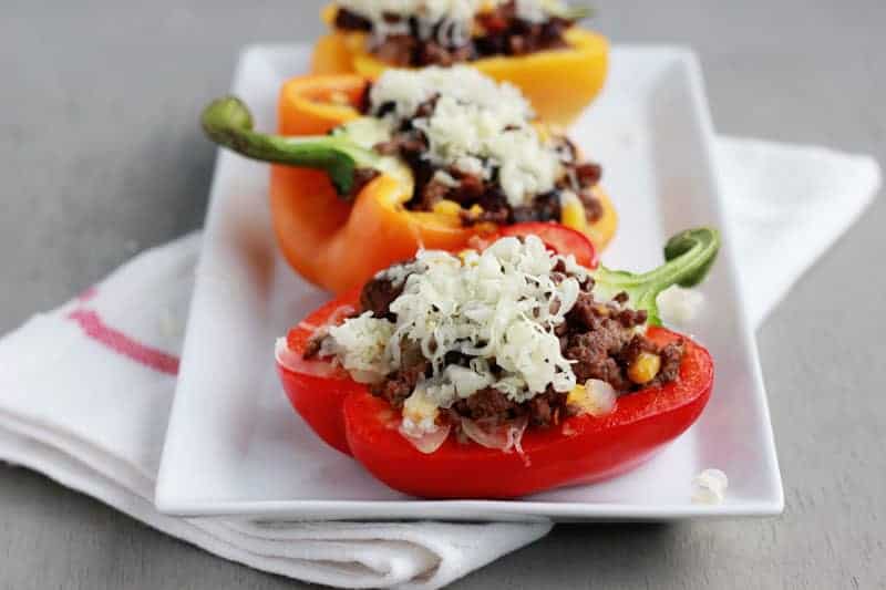 Taco stuffed peppers on a white plate