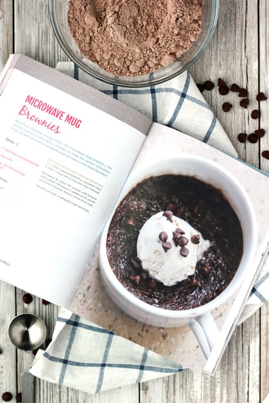 Cookbook open to a page that reads "microwave mug brownies"