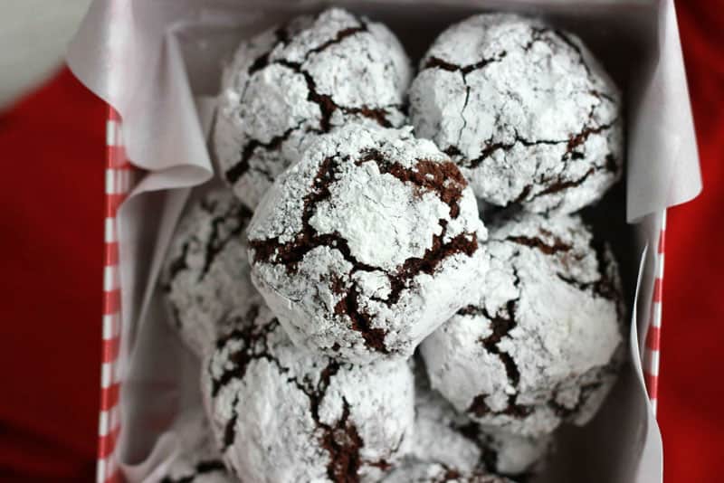 Chocolate cookies stacked in red holiday box