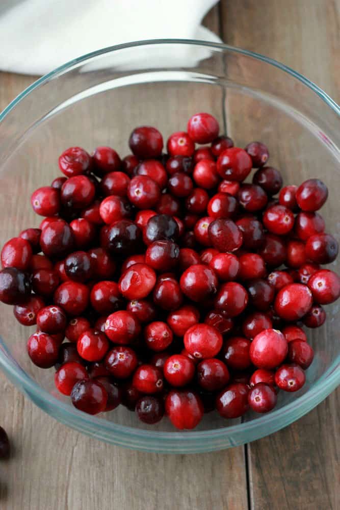 glass bowl filled with fresh cranberries