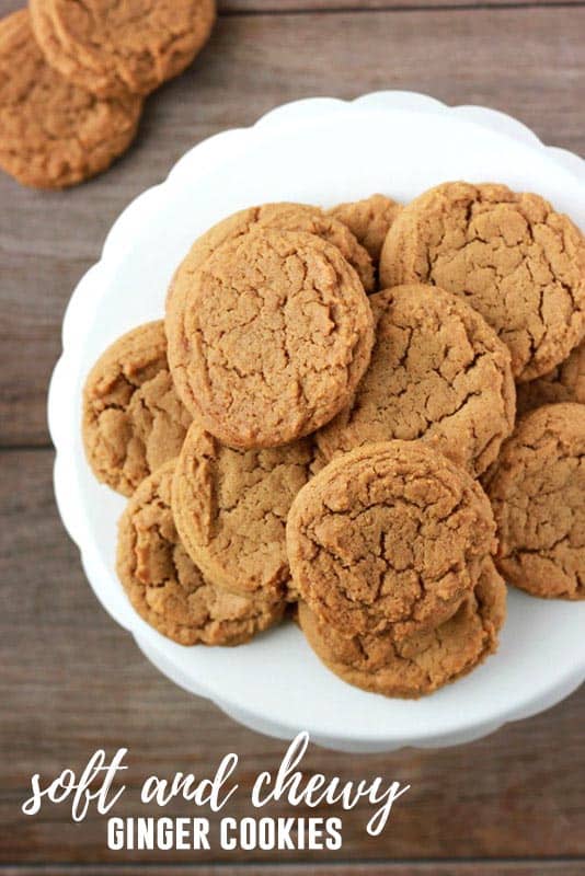 white serving tray topped with a mountain of ginger cookies