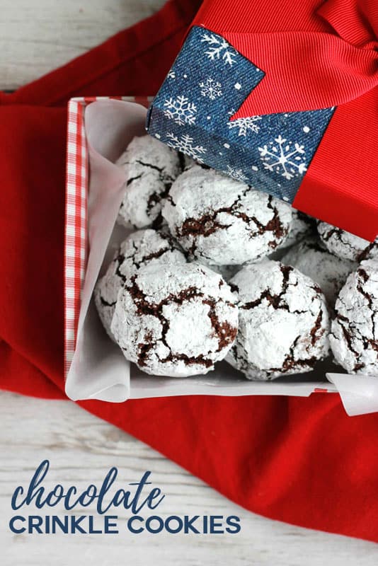 Chocolate Crinkle Cookies stacked in a holiday box