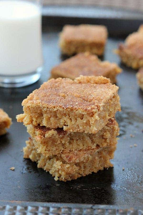snickerdoodle blondies stacked on a baking tray