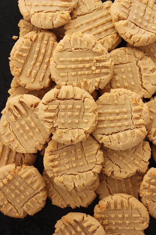 peanut butter cookies stacked on black tray