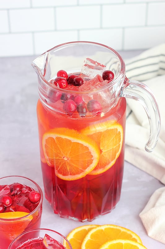 punch in a large pitcher with sliced oranges