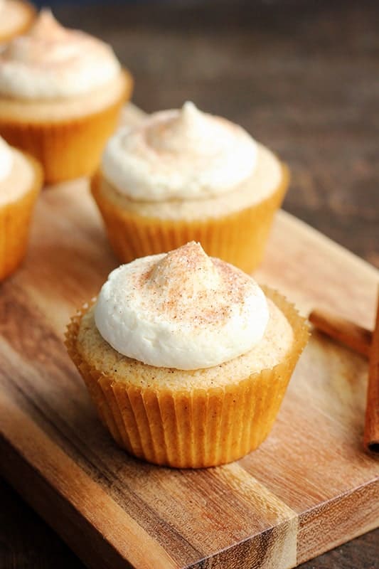 snickerdoodle cupcakes on a wood board