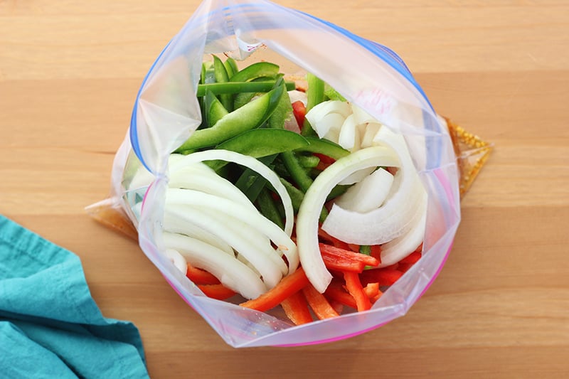 chopped onion and peppers in ziplock bag