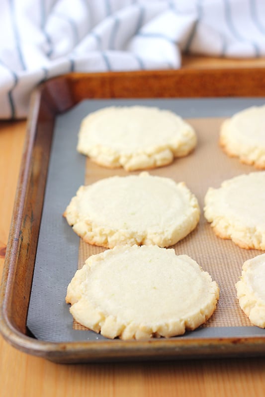 sugar cookies cooling on a pan