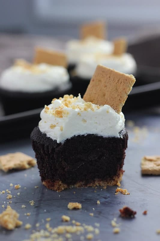 smore cupcake with marshmallow frosting on table