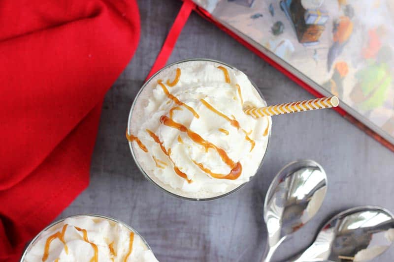 whipped cream in cup drizzled with butterscotch sauce