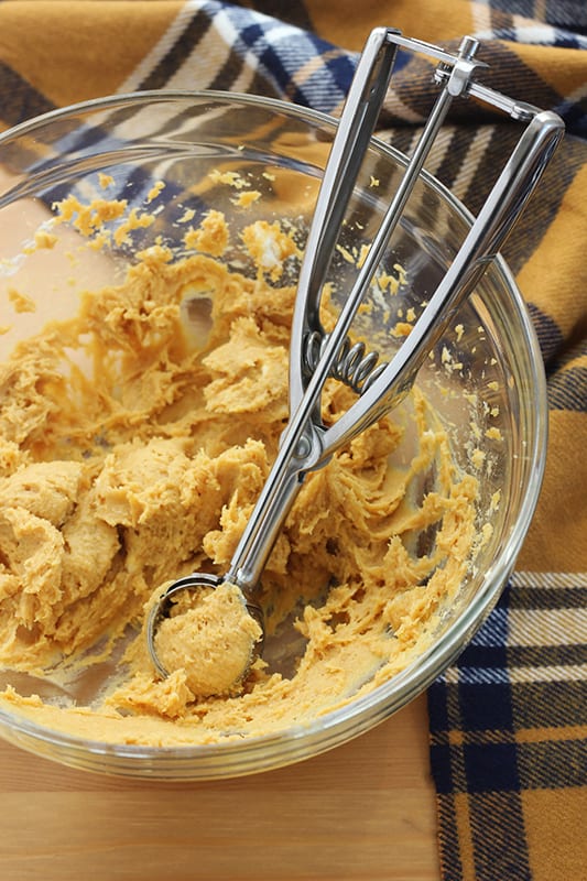 pumpkin truffle dough in a clear bowl