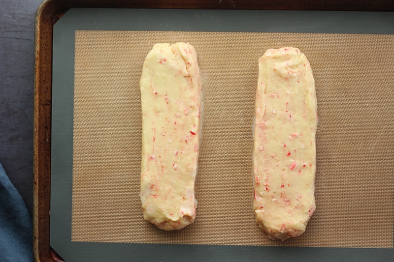 Peppermint Biscotti dough shaped into loafs on tray