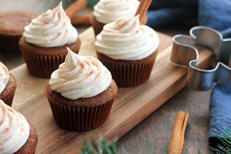 Gingerbread cupcakes on a wooden cutting board