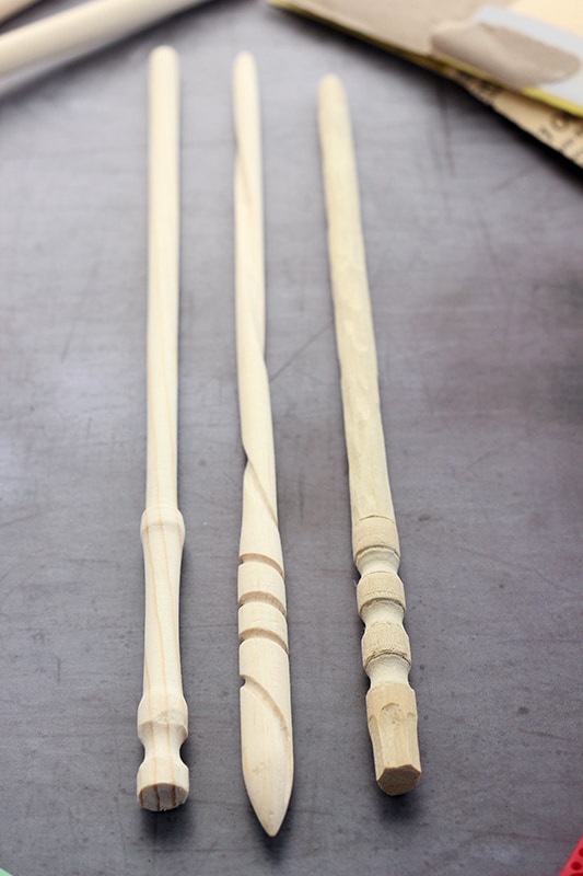 Unfinished DIY Harry Potter Wands sitting on a dark grey counter top