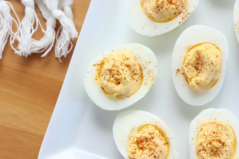 classic recipe for deviled eggs on a white serving plate