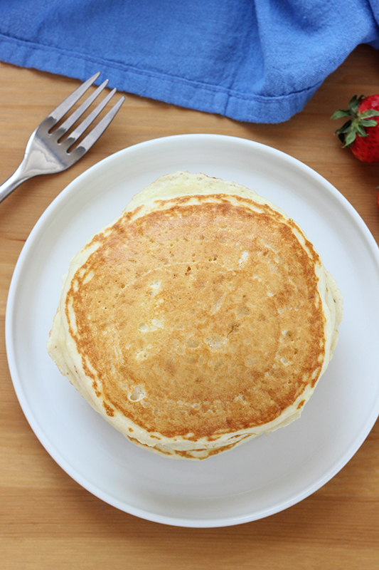 stack of pancakes on a white plate