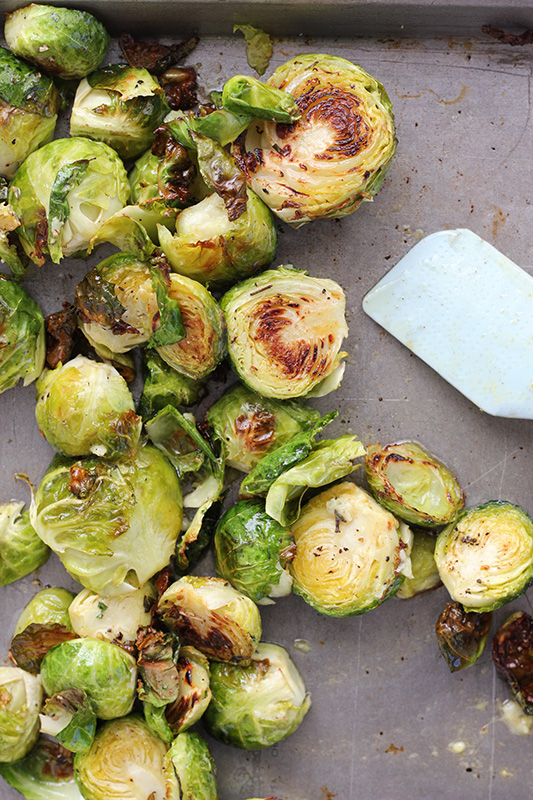 cooked brussels sprouts on a baking pan