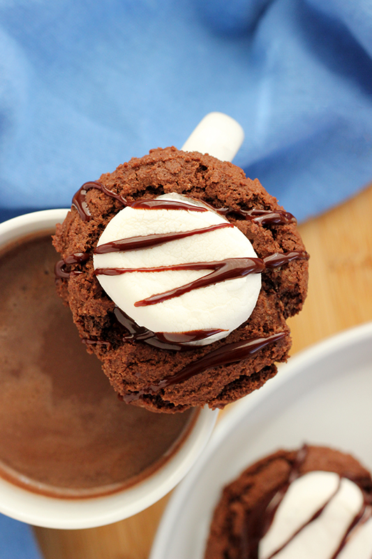 hot chocolate cookie balanced on a cup of hot chocolate