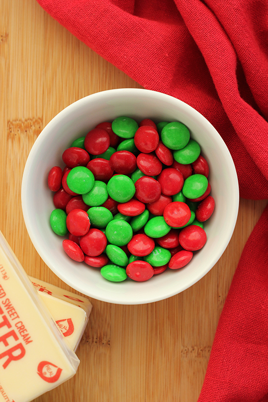 bowl of m&m candies on a wooden table