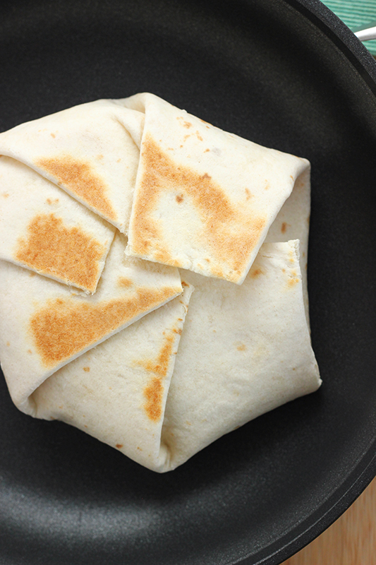 folded and grilled tortilla on a pan