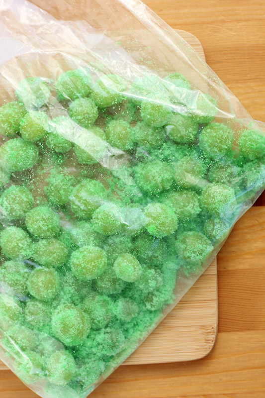 green grapes inside of a ziptop bag with jello powder