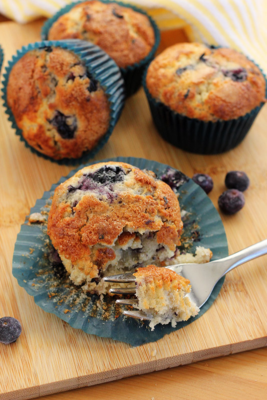 blueberry muffin with a bite taken out on a fork