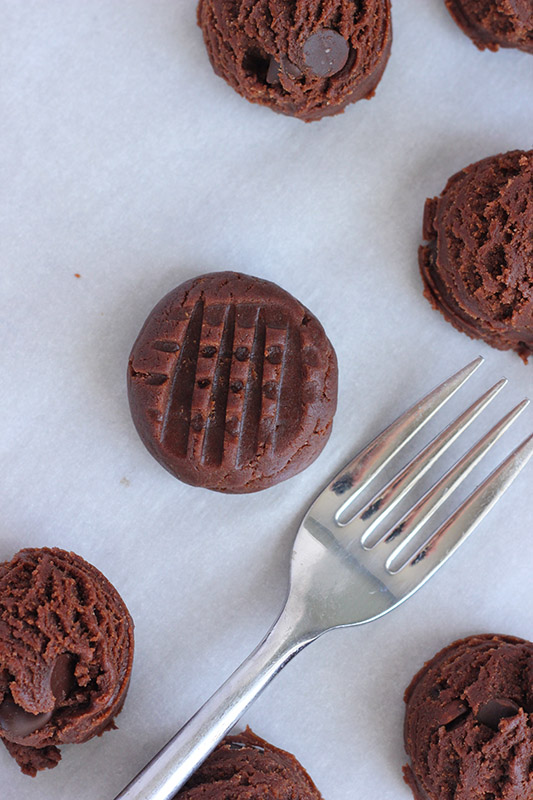 Chocolate cookie dough rolled into a round and pressed with a fork