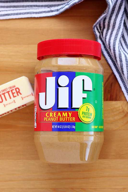 jar of peanut butter on a wooden table 