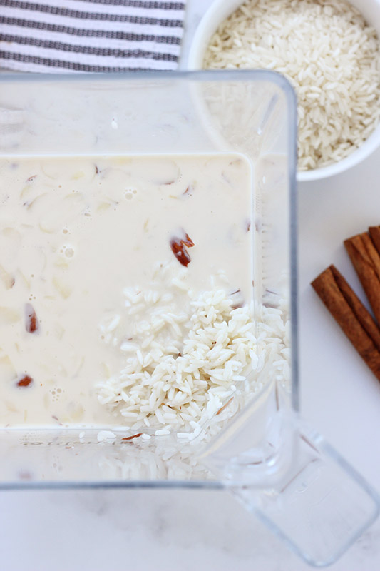 rice milk in a blender on a white table