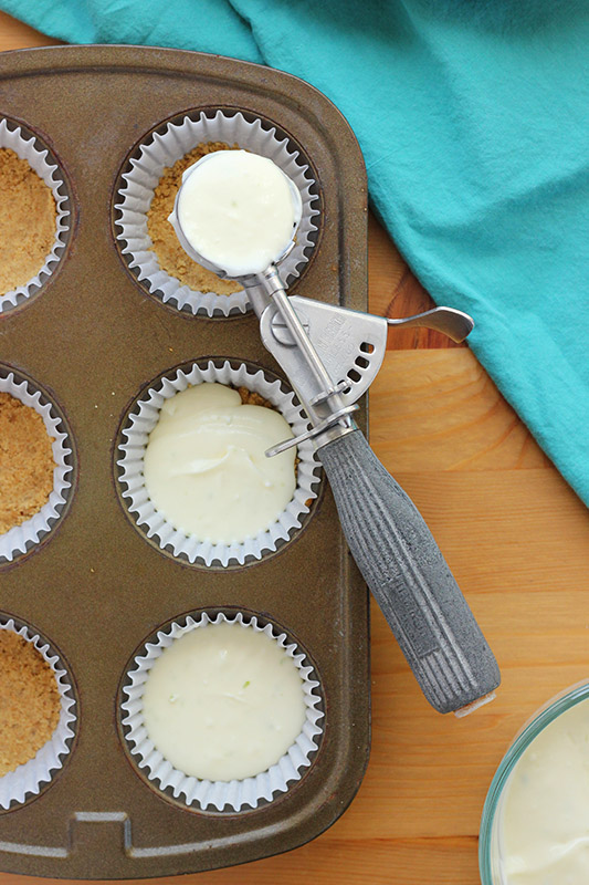cupcake tin filled with cheesecake batter