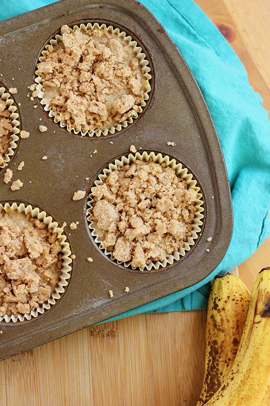 unbaked muffins topped with crumble topping