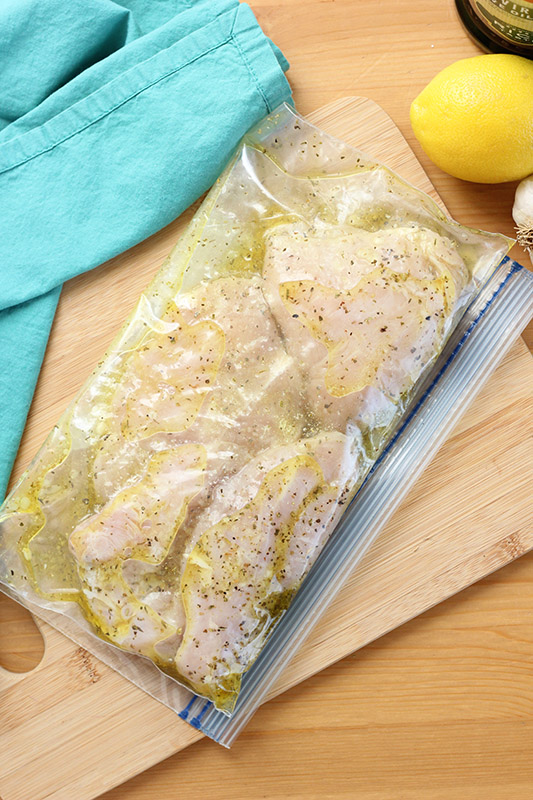 chicken breast inside a zip top bag with marinade