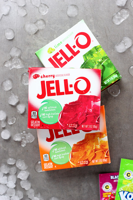 boxes of jell-o sitting on a serving tray with ice