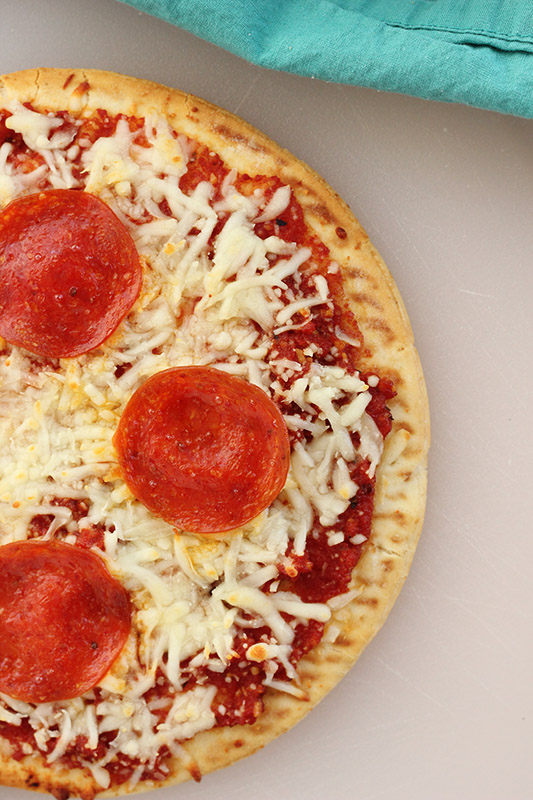 closeup of a personal pizza with pepperoni 