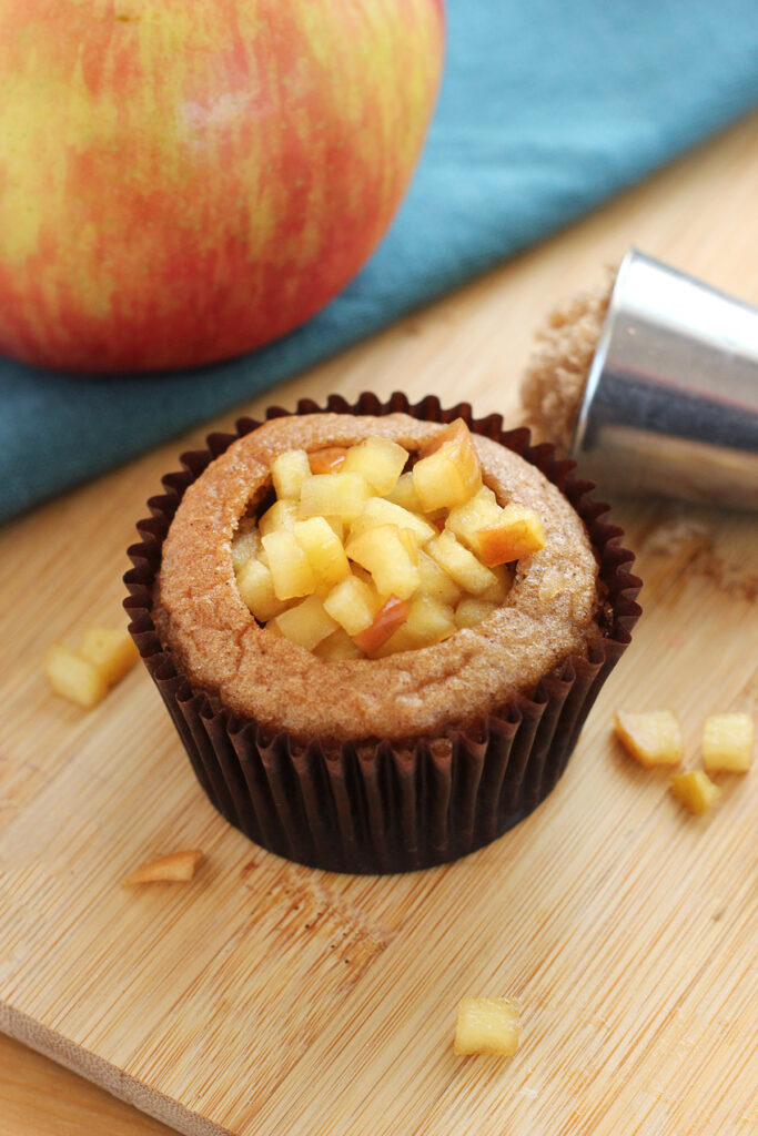 cupcake with the middle cut out and filled with apple filling