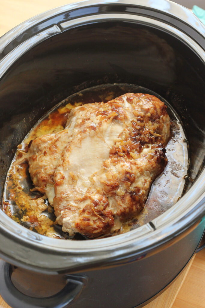 cooked turkey inside a slow cooker