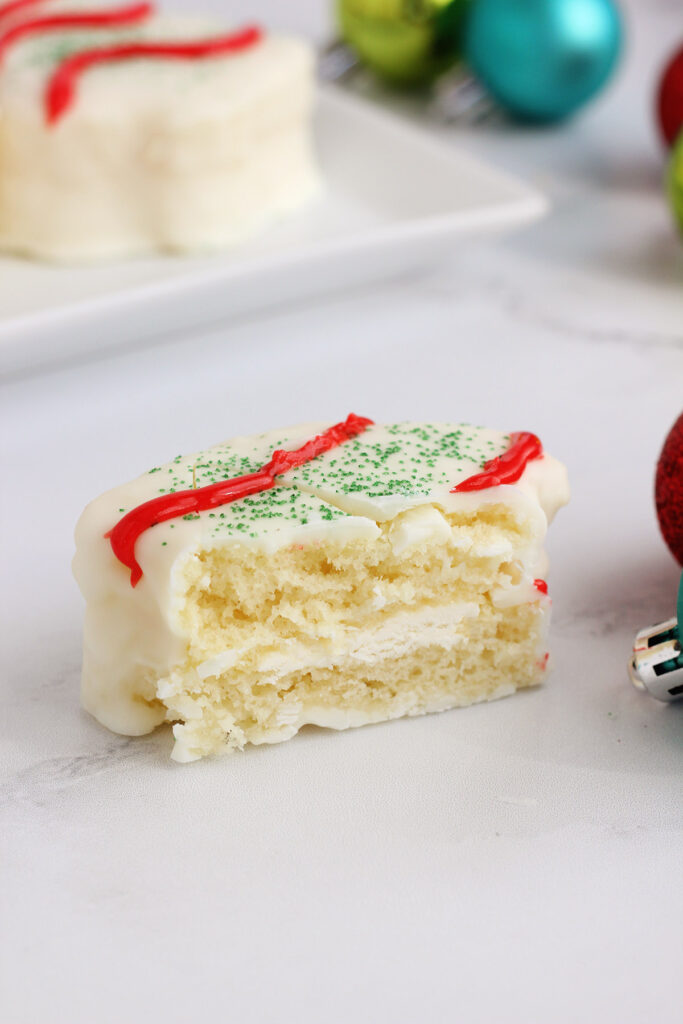Little Debbie Christmas Cake copycat cut in half on a white table