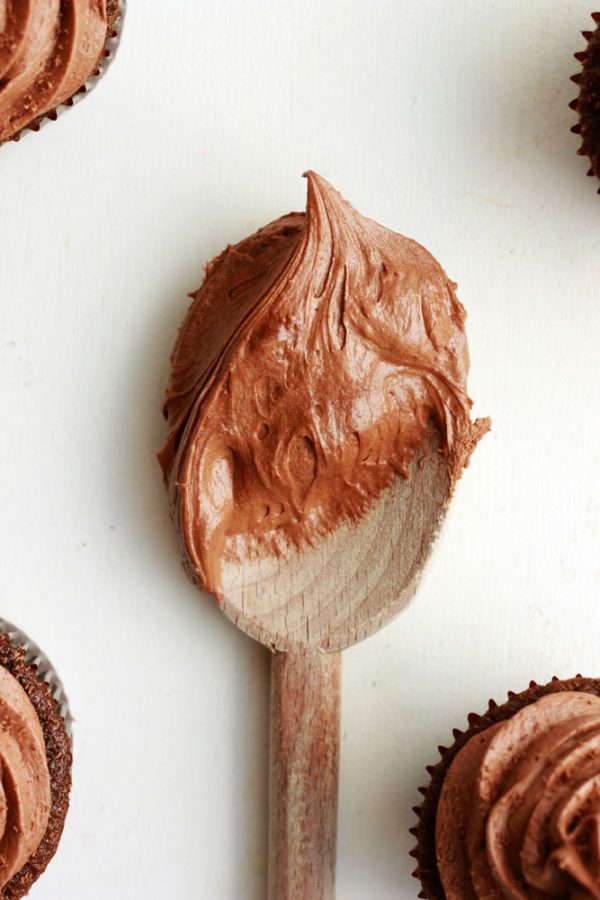 fudge frosting on a wooden spoon