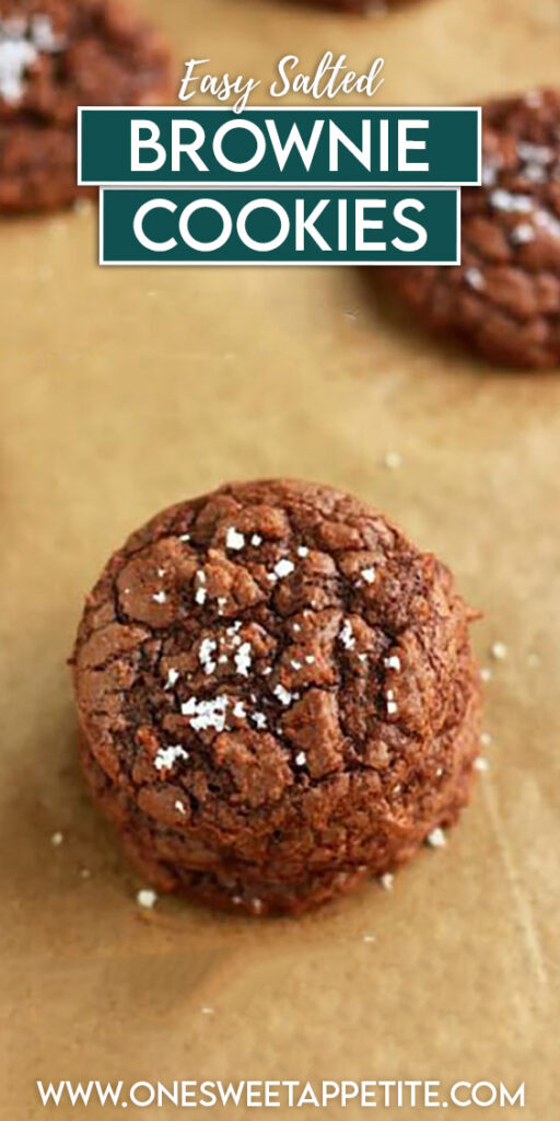cookies lined across a brown piece of parchment sprinkled with salt with text overlay reading "easy salted brownie cookies"