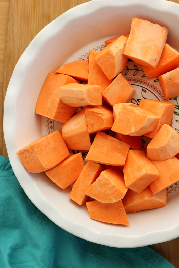 cubed sweet potato sitting in a pie dish